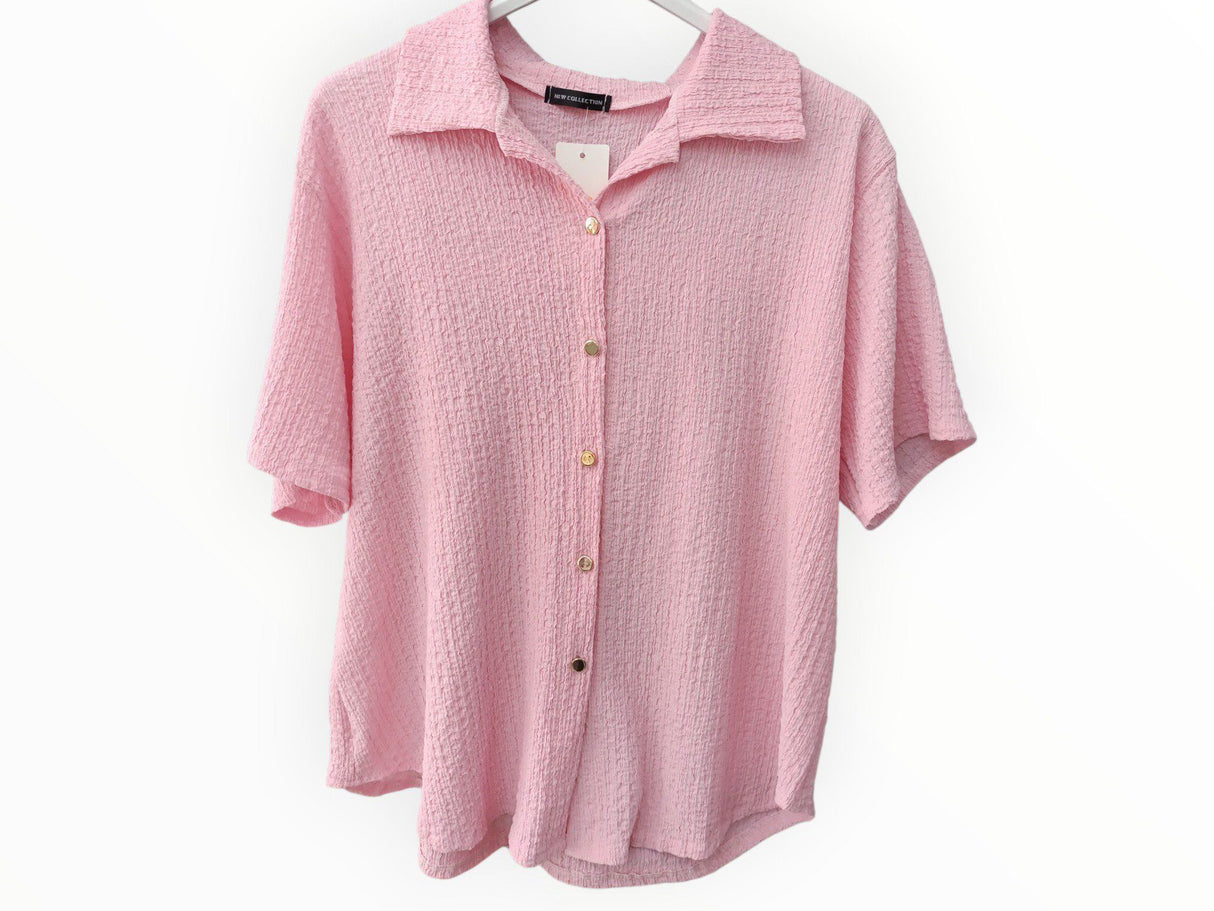 Camiseta con botones manga corta rosa 1