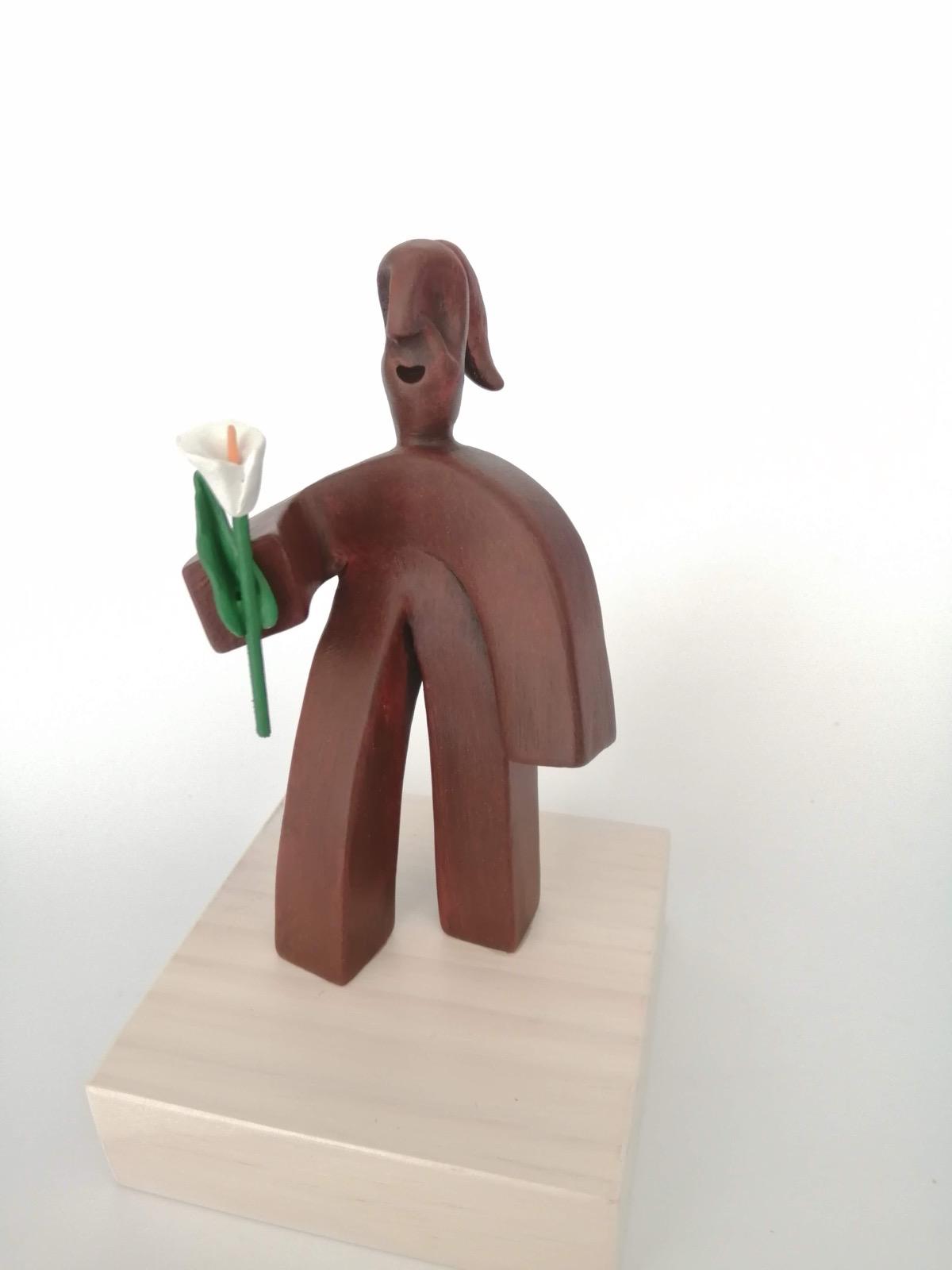 Pieza cerámica Personaje con flor - Dendago