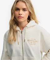 Sudadera con capucha y cremallera forrada de piel de lujo blanco roto hueso del desierto Superdry&Co